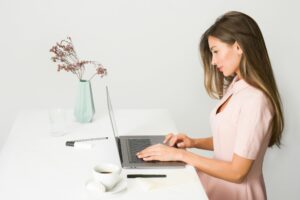 Woman typing on computer