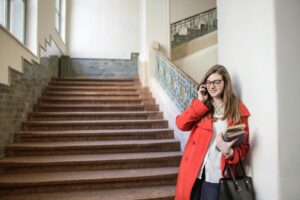 Woman on a phone call by stairs