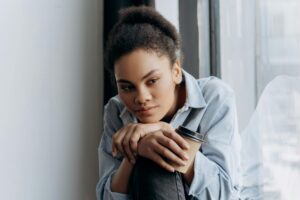 Woman thinking with her chin resting on her hands